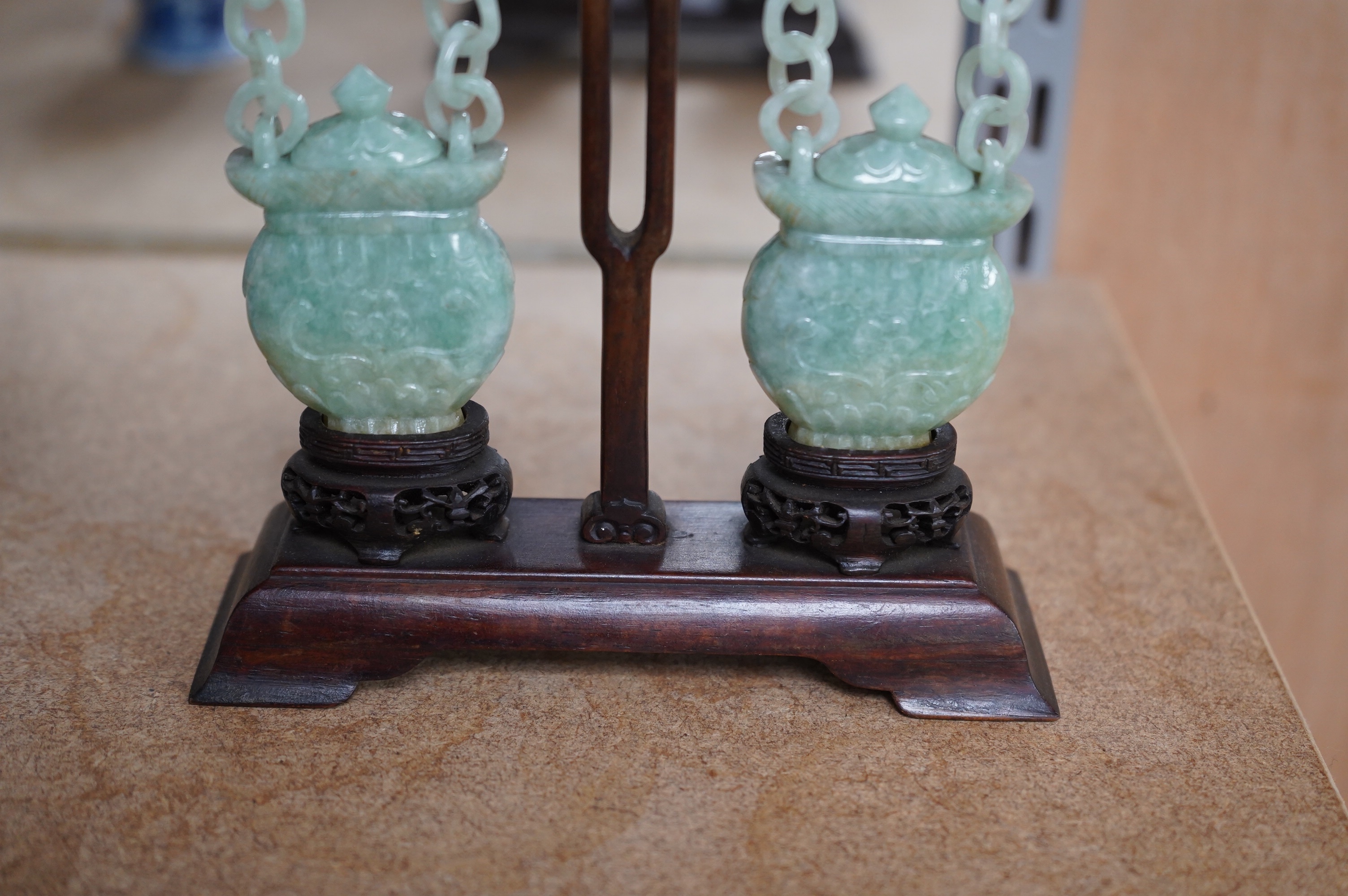 A pair of Chinese jadeite hanging baskets and covers, with original stand and hanging support, first half 20th century, 18cm high. Condition - good